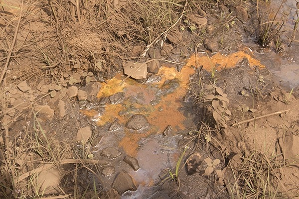 Contaminated residue in the only stream in Okobo